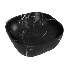 Раковина для ванной накладная Teymi Solli 41 artceramic цвет мрамор черный матовый T50383 — элегантное решение для интерьера в современном стиле. Квадратная форма с закругленными углами, размером 410x410 мм подчёркивает геометрию пространства, создавая выразительный акцент в ванной комнате.Изделие выполнено из прочного санфарфора, обеспечивающего надёжность и длительный срок службы. Матовая поверхность с эффектом чёрного мрамора придаёт благородство и глубину цвету, гармонируя с разными отделочными материалами — от бетона до дерева и плитки. Структурированный рисунок делает модель визуально интересной и подчёркивает индивидуальность интерьера.Накладной монтаж на столешницу или тумбу упрощает установку, не требует врезки и позволяет быстро обновить пространство без сложных работ. Отсутствие отверстий под смеситель и перелив даёт свободу выбора сантехники и даёт возможность интегрировать модель в самые разные проекты. Оптимальная глубина чаши — 140 мм — обеспечивает удобство использования и помогает минимизировать разбрызгивание воды.Teymi Solli 41 T50383 — воплощение лаконичного минимализма без лишних элементов. Нет мыльницы, крыла или дополнительных аксессуаров — только чистые линии и эффектный внешний вид. Модель подходит для оформления современных ванных комнат, где ценится сочетание функциональности и эстетики. Раковина для ванной накладная Teymi Solli 41 artceramic цвет мрамор черный матовый T50383 — элегантное решение для интерьера в современном стиле. Квадратная форма с закругленными углами, размером 410x410 мм подчёркивает геометрию пространства, создавая выразительный акцент в ванной комнате.Изделие выполнено из прочного санфарфора, обеспечивающего надёжность и длительный срок службы. Матовая поверхность с эффектом чёрного мрамора придаёт благородство и глубину цвету, гармонируя с разными отделочными материалами — от бетона до дерева и плитки. Структурированный рисунок делает модель визуально интересной и подчёркивает индивидуальность интерьера.Накладной монтаж на столешницу или тумбу упрощает установку, не требует врезки и позволяет быстро обновить пространство без сложных работ. Отсутствие отверстий под смеситель и перелив даёт свободу выбора сантехники и даёт возможность интегрировать модель в самые разные проекты. Оптимальная глубина чаши — 140 мм — обеспечивает удобство использования и помогает минимизировать разбрызгивание воды.Teymi Solli 41 T50383 — воплощение лаконичного минимализма без лишних элементов. Нет мыльницы, крыла или дополнительных аксессуаров — только чистые линии и эффектный внешний вид. Модель подходит для оформления современных ванных комнат, где ценится сочетание функциональности и эстетики.