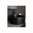 Раковины серии Esfera с круглой чашей — это эталон европейских стандартов и испанского мастерства. Раковина накладная GID N9130bg — идеальный выбор для тех, кто ценит стиль и минимализм в интерьере. Матовая черная керамика с графитовым покрытием придаст вашей ванной комнате современный и неповторимый акцент. Круглая форма создает ощущение легкости и гармонии, визуально расширяя пространство. Накладная конструкция не только упрощает монтаж, но и позволяет сэкономить место на столешнице. Благодаря отсутствию отверстия под смеситель раковина позволяет реализовать различные дизайнерские решения по размещению смесителя. Это универсальное и востребованное решение для современных проектов.