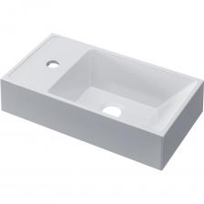 Белая раковина Uperwood Classic New 41х22,5х10 см ? Раковина для ванной комнаты шириной 40 см от бренда Uperwood из коллекции Classic New изготовлена из литьевого мрамора. Раковина в этом размере представлена моделью БЕЗ декоративной накладки для слива и без перелива. Коллекция Classic New также представлена раковинами шириной от 50 до 100 см, в белом и черном глянцевом исполнении. ? Литьевой мрамор гарантирует гигиеническую безопасность изделий и характеризуется высокими бактерицидными свойствами. ? Покрытие раковины - гелькоут, выполняет как декоративную, так и защитную функцию. Каждая раковина из коллекции Uperwood Classic New обладает уникальными характеристиками прочности, устойчивости к истиранию, а также выдающейся стойкостью и качеством цвета. ? Гарантия от производителя - 4 года. Каждое изделие от бренда Uperwood надежно упаковано.Лаконичная форма раковины отлично впишется в любой современный интерьер ванной комнаты. ?РаковинаUperwood Classic New шириной 40 см имеет отверстие для смесителя. ? Конструкция раковины позволяет установить ее на тумбу и на столешницу. ? Раковина оборачиваемая. Сторона с отверстием для смесителя может быть как слева, так и справа на усмотрение покупателя. ? Отверстие перелива отсутствует.