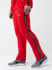 Спортивные штаны красного цвета с лампасами, без манжета. Плотный футер