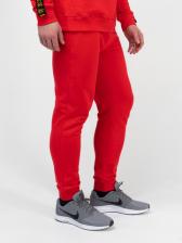 Спортивные штаны красного цвета с манжетами, без лампасов. Плотный футер