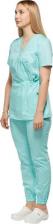Рабочая одежда, обувь Комус Костюм медицинский женский выполнен в бирюзовом цвете. Подходит для медицинского персонала, бьюти-мастеров, ветеринаров и парикмахеров. Костюм