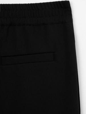 Брюки текстильные зауженные чёрные для девочки (170) – фото 4